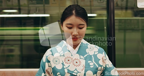 Image of Japanese woman, happy and travel by train in kimono and public transport on metro bullet in city. Person, journey or traditional clothes in fast vehicle on weekend or commute in tokyo on adventure
