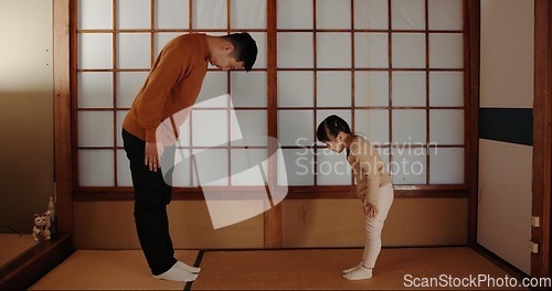 Image of Traditional, home and Japanese father and child bow for greeting ceremony, ritual and respect. Family, culture and dad with young girl in indigenous house for bonding, relationship and love together