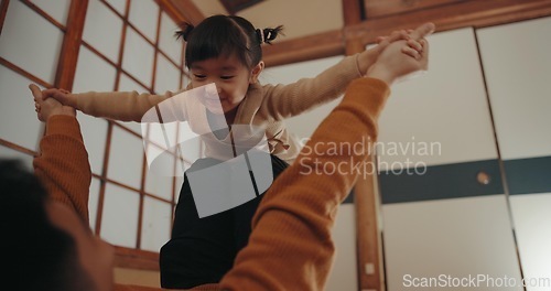 Image of Baby, airplane game and mom in a Japanese family home with toddler, love and happy fun. House, mother and young girl with smile, living room and flying with bonding together with a child and mama