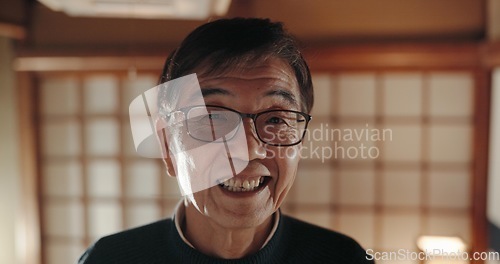 Image of Happy, portrait and senior Japanese man at his home with positive, good and confident attitude. Smile, glasses and face of elderly male person in retirement with pride in modern house in Tokyo Japan.