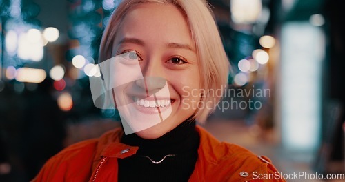 Image of Japanese, city and portrait of happy woman at night in Tokyo with freedom on travel, adventure or journey. Gen z, girl or excited to explore urban town street on vacation or holiday with neon lights