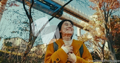 Image of Japanese, woman and happy travel in park on vacation, adventure and explore path with trees in autumn. Gen z, student and happy walk on holiday in nature, forest and train rail in Kyoto woods