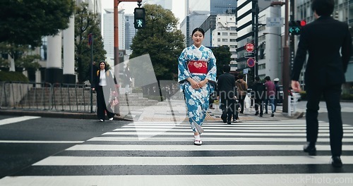 Image of Woman, Japanese traditional dress and walking in city, zebra crossing and travel with journey outdoor. Fashion, adventure and urban street in Kyoto, kimono for culture and style with local trip