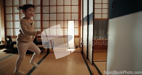 Image of Happy, home and Japanese girl in a family house running for game, fun and playing. Young child, morning and excited in a living room with sliding door from Japan with youth activity and smile of kid