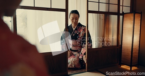 Image of Woman, Japanese and tea ceremony for healing practice or respect for ritual, wellness or tatami room. Female person, kneel and warm drink for mindfulness zen in Tokyo for spiritual, health or calm