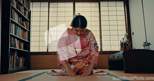 Image of Woman, Japanese and traditional spiritual respect in Chashitsu room for ritual, gratitude or wellness. Asian person, kneel and kimono dress for practice mindfulness healing, Tokyo or tea ceremony