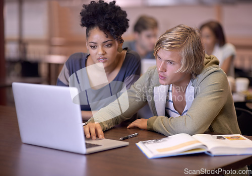 Image of University, students and people in library on laptop for online research, studying and learning. Education, college and man and woman with textbooks, computer and reading website for knowledge