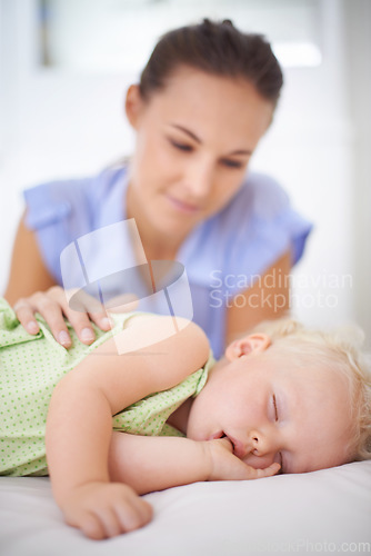 Image of Sweet, sleeping and mother with baby on bed for bonding, relax and happy cute relationship. Love, smile and young mom watching girl child, kid or toddler taking a nap in bedroom or nursery at home.