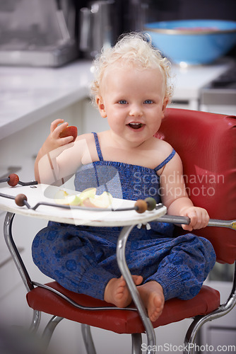 Image of Portrait, high chair and kid with apple, healthy diet and nutrition for breakfast. Hungry, baby and toddler eating fruit for growth, childhood development and happy cute child with vegan food in home