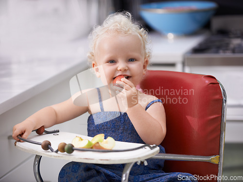 Image of Portrait, high chair and baby with apple, healthy diet and nutrition for breakfast. Hungry, kid and toddler eating fruit for growth, childhood development and happy cute child with vegan food in home