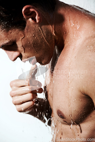 Image of Profile of man in shower to relax, cleaning hair and body for morning wellness, hygiene and skin routine. Grooming, skincare and male model with muscle washing in water, self care and calm bathroom.