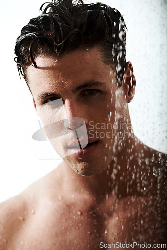 Image of Portrait of man in shower with muscle, cleaning hair and body for morning wellness, hygiene and routine. Grooming, skincare and relax, male model washing in water with self care and calm bathroom.