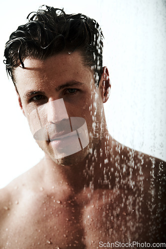 Image of Portrait of man in shower, cleaning body and grooming for morning wellness, hygiene and skin routine. Relax, skincare and face of male model with muscle washing in water, self care and calm bathroom.