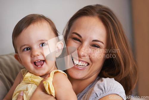 Image of Mother, baby and smile in embrace at home, love and together for bonding in childhood. Mommy, daughter and support for happy toddler in child development, mama and security or connection on sofa
