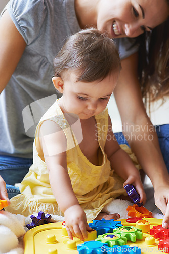 Image of Baby, mom and toys in living room floor, bonding together and sensory growth in family home. Motherhood, girl and play with child development for games, childhood or fun with love, cognition or kids