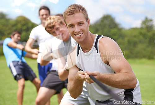 Image of Rope, pull and men portrait with teamwork, tug of war and fitness outdoor on sport field. Training, workout and athlete group with support together for competition and strong arm exercise for health