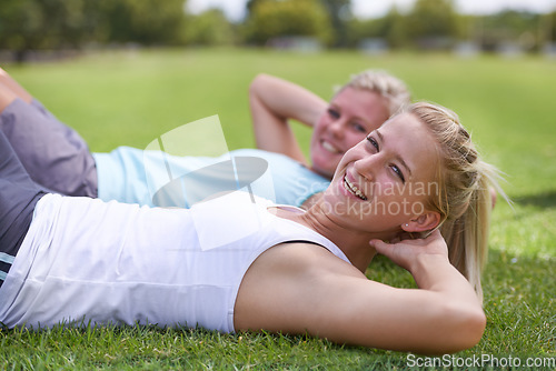 Image of Happy woman, portrait and friends in sit ups for outdoor exercise, workout or fitness together on green grass. Young active female person or people smile for training or health and wellness on field