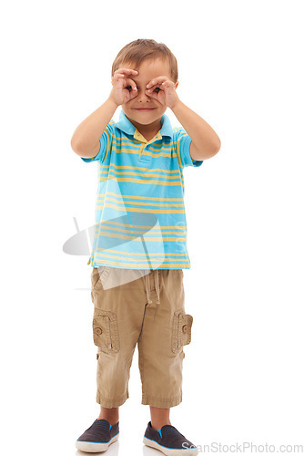 Image of Hands, binoculars and portrait of kid search, find or inspection in white background of studio. Curious, vision and child with gesture to spy for research, knowledge and learning from sightseeing