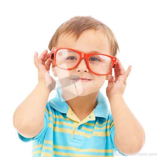 Image of Child, boy and frames or glasses in studio, eyes and vision support by white background. Male person, kid and ophthalmology for eyecare, red spectacles and stylish fashion by backdrop for wellness