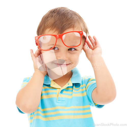 Image of Child, boy and smile for glasses in studio, eyes and vision support by white background. Happy male person, kid and ophthalmology for eyecare, red spectacles and stylish fashion or humor and goofy