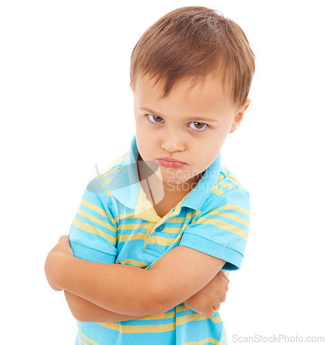 Image of Boy, arms crossed and anger in studio portrait with mental health, anxiety and stress by white background. Child, sad and person with depression, frustrated and fear with grief, moody and upset