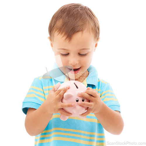 Image of Kid, boy and piggy bank for change, finance and smiling in studio by white background. Happy male person, child and money box for future, investing and cash growth in container, savings and security