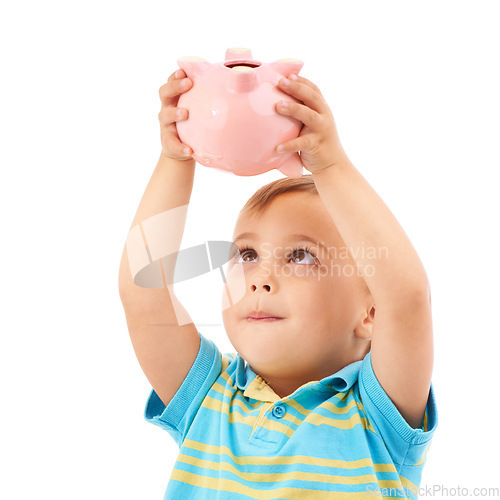 Image of Kid, boy and piggy bank for change, money box and checking savings in studio by white background. Male person, child and planning for future, investing and cash growth in container, coin and security