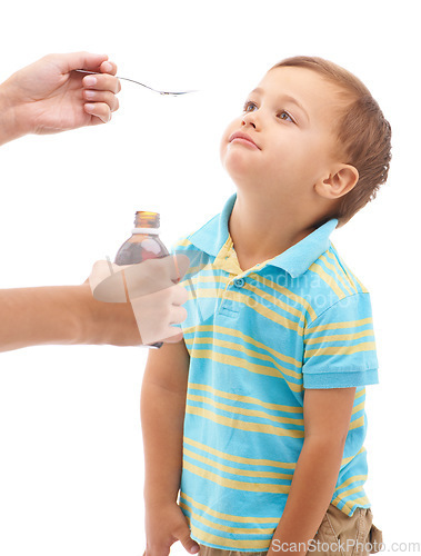 Image of Hands, medicine bottle and spoon for boy in studio, sad and thinking with tongue by white background. Kid, mother and liquid for healthcare, pharmaceutical product and helping sick child for wellness