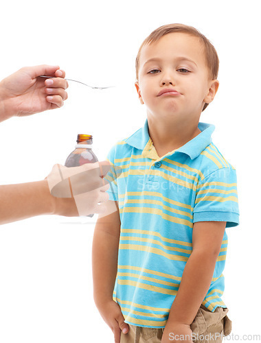 Image of Hands, medicine bottle and spoon for kid in studio, health or portrait with fluid by white background. Boy, mother and liquid for healthcare, pharmaceutical product or helping sick child for wellness