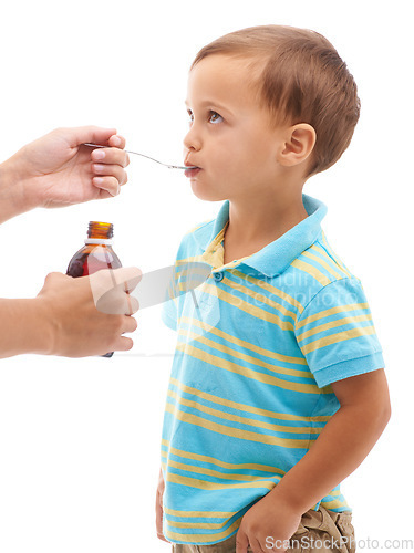 Image of Hands, medicine bottle and kid drink in studio, health or profile for spoon in mouth by white background. Boy, parent and liquid for healthcare, pharma product or helping sick child for immune system