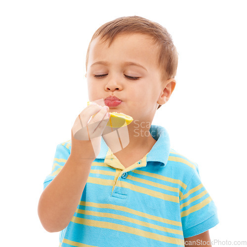 Image of Eating, fruit and portrait of child with lemon in white background, studio and mockup space. Sour, slice and kid with healthy food, nutrition and citrus in diet for wellness and vitamin c benefits