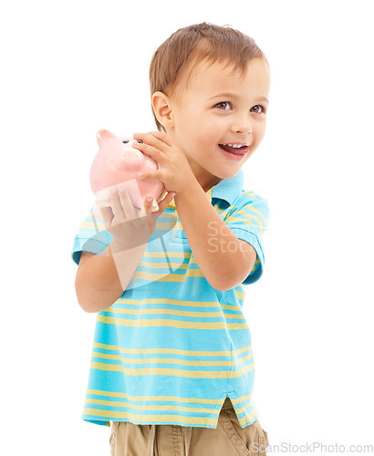 Image of Child, boy and piggy bank for money, saving and smiling in studio by white background. Happy male person, boy and moneybox for future, investing and cash growth in container, coin and security