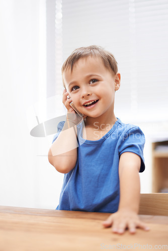 Image of Toddler, boy and phonecall at home, playing and communication with technology. Happiness, calling and conversation for learning, cellphone and excited for child development, mobile and digital