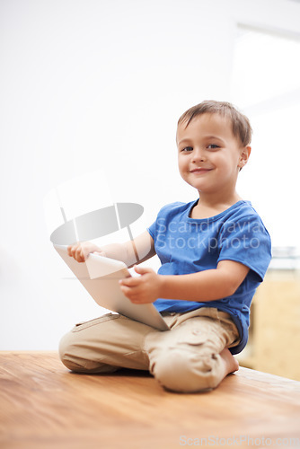 Image of Boy, tablet and portrait with games, kid and internet with network, connection and home. Child development, apartment and technology with online educational activity, face or digital app for learning