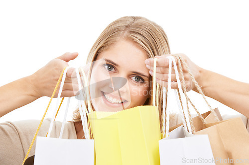 Image of Portrait, woman and shopping bag in studio for retail sales, financial freedom or commerce savings from market white background. Face of happy customer with gift bags for deal, discount and promotion