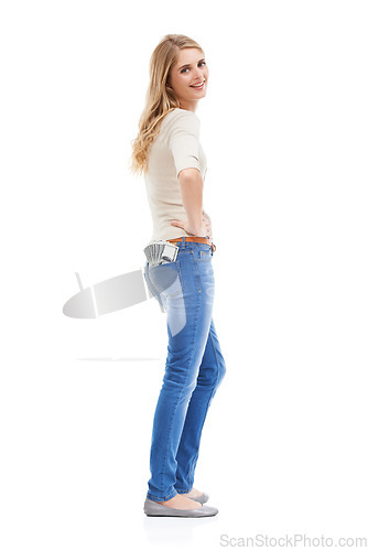 Image of Portrait, woman and money in jeans pocket for financial freedom, gambling and lottery bonus in studio on white background. Happy winner with cashback savings, wealthy investment and finance in pants