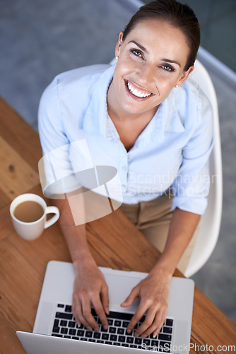 Image of Portrait, happy woman and coffee with laptop in office for planning online research at desk from above. Employee, smile or typing email on computer for digital business administration with cup of tea