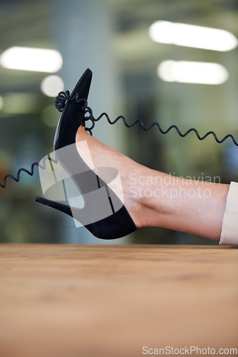 Image of Shoes, desk and relax woman with telephone cable in consultancy office for networking, telemarketing or communication. High heel, easy or closeup of agent feet with phone call, landline or work break