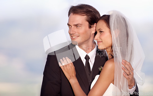 Image of Couple, love and hug on wedding day in outdoors, trust and commitment for marriage or relationship. Happy people, embrace and smiling in outdoor ceremony, partnership and celebrating vow or bonding