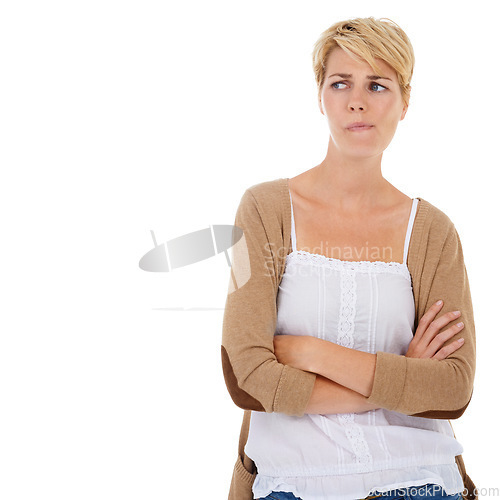 Image of Woman, thinking and arms crossed in doubt, choice or decision on a white studio background. Young female person, model or blonde looking in distance, wonder or thought for ideas on mockup space