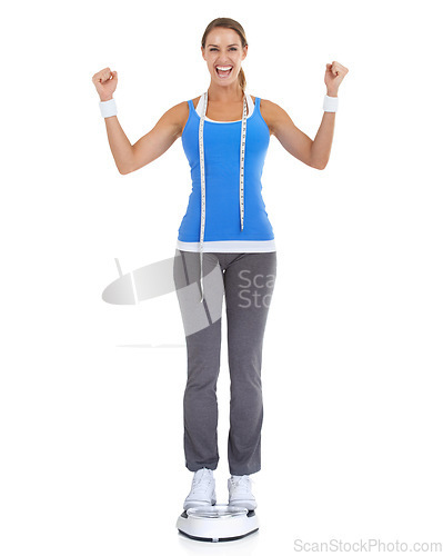 Image of Woman, celebration and scale or measure tape in studio for fitness, weight loss success or health results. Model portrait for diet goals, exercise balance or workout achievement on a white background