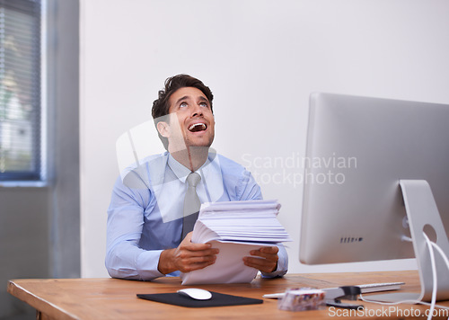 Image of Businessman, paperwork and frustrated at desk in office with burnout, mental health and deadline. Entrepreneur, person and stress with documents at workplace for overwork, anxiety and career fail