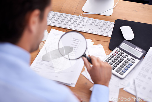 Image of Finance, businessman and magnifying glass in office with bookkeeper career, budget and bills planning. Entrepreneur, person and accounting with rear view for asset management, expenses and investment