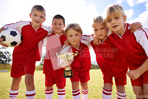 Image of Players, soccer team and children with cup, victory and girls with boys, support or proud. Achievement, sports and friendship, together and happy for win, ready for game or physical activity