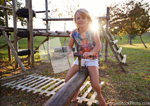 Image of Happy girl, portrait and riding seesaw in park sunset for fun holiday, weekend or outdoor break in nature. Face of female person, kid or child smile on playground for childhood activity outside