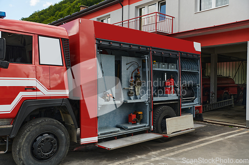 Image of Close-up of essential firefighting equipment on a modern firetruck, showcasing tools and gear ready for emergency response to hazardous fire situations