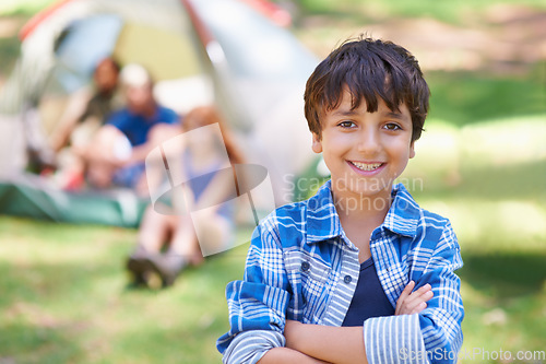 Image of Kid, portrait and smile on camping adventure in outdoors, happy and relaxing on vacation or holiday. Male person, child and face or confident in park, childhood and summer or cheerful in nature