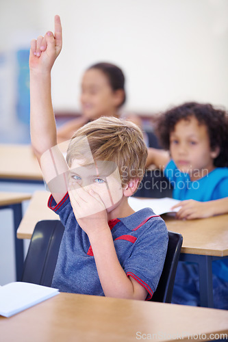 Image of Young boy, classroom and hand up for bad smell, odor or scent sitting by desk at school. Little male person, student or youth with question to leave class from disgust, fart or breathe in bacteria