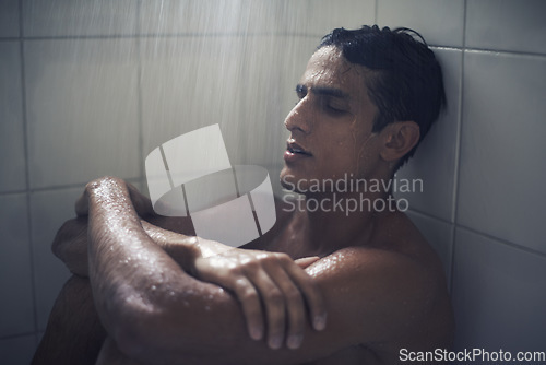 Image of Man, shower and depression or worry in bathroom and grooming in morning routine, water and care for healthy skin. Male person, cosmetology and skincare or clean, naked and mental health at home