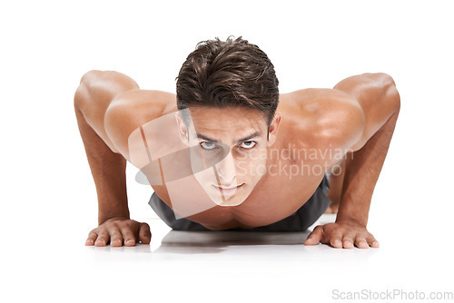 Image of Man, portrait and push up or exercise in studio, core and cardio workout for muscle development. Male person, athlete and face by white background, bodybuilding and performance challenge or fitness